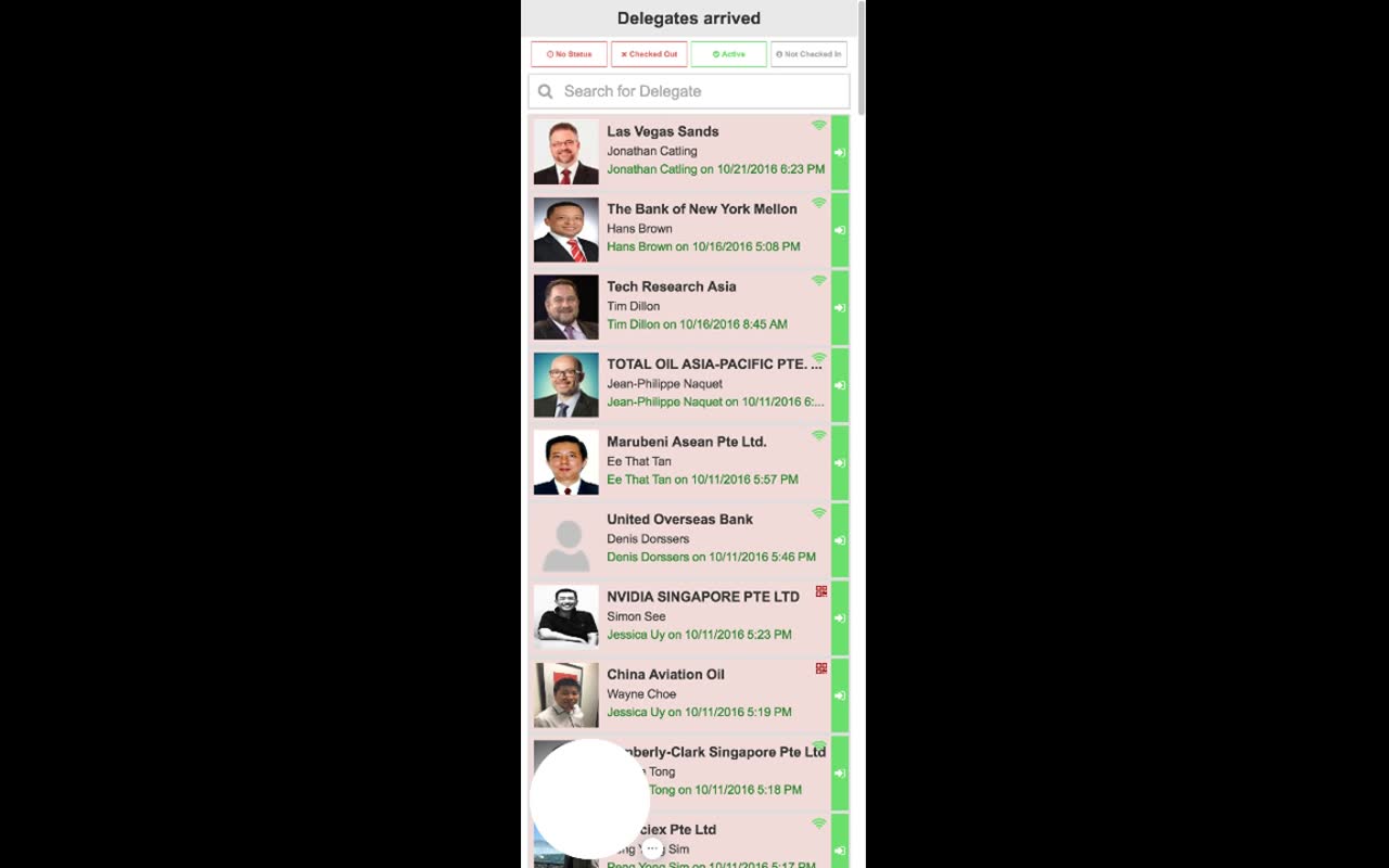 Delegates arrived screen — title at top, status filter pills (No Status, Checked Out, Active highlighted, Not Checked In), search field, then a scrolling list of delegate rows with photo, company, name, and the staff member who handled the check-in plus timestamp; a green action button on the right of each row