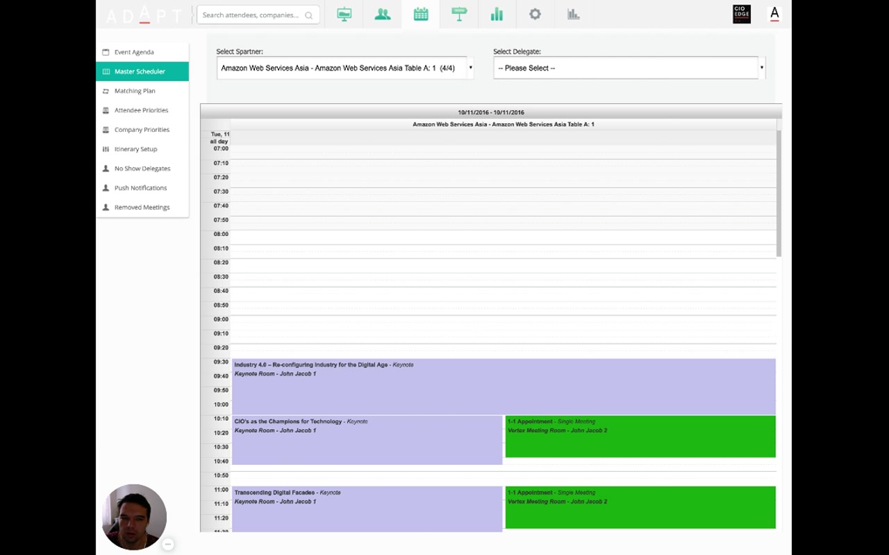 Master Scheduler with two top dropdowns (Select Spartner showing 'Amazon Web Services Asia Table A: 1 (4/4)' and Select Delegate showing 'Please Select'), then a calendar grid showing the sponsor's day with purple Keynote sessions and green 1-1 Appointment sessions